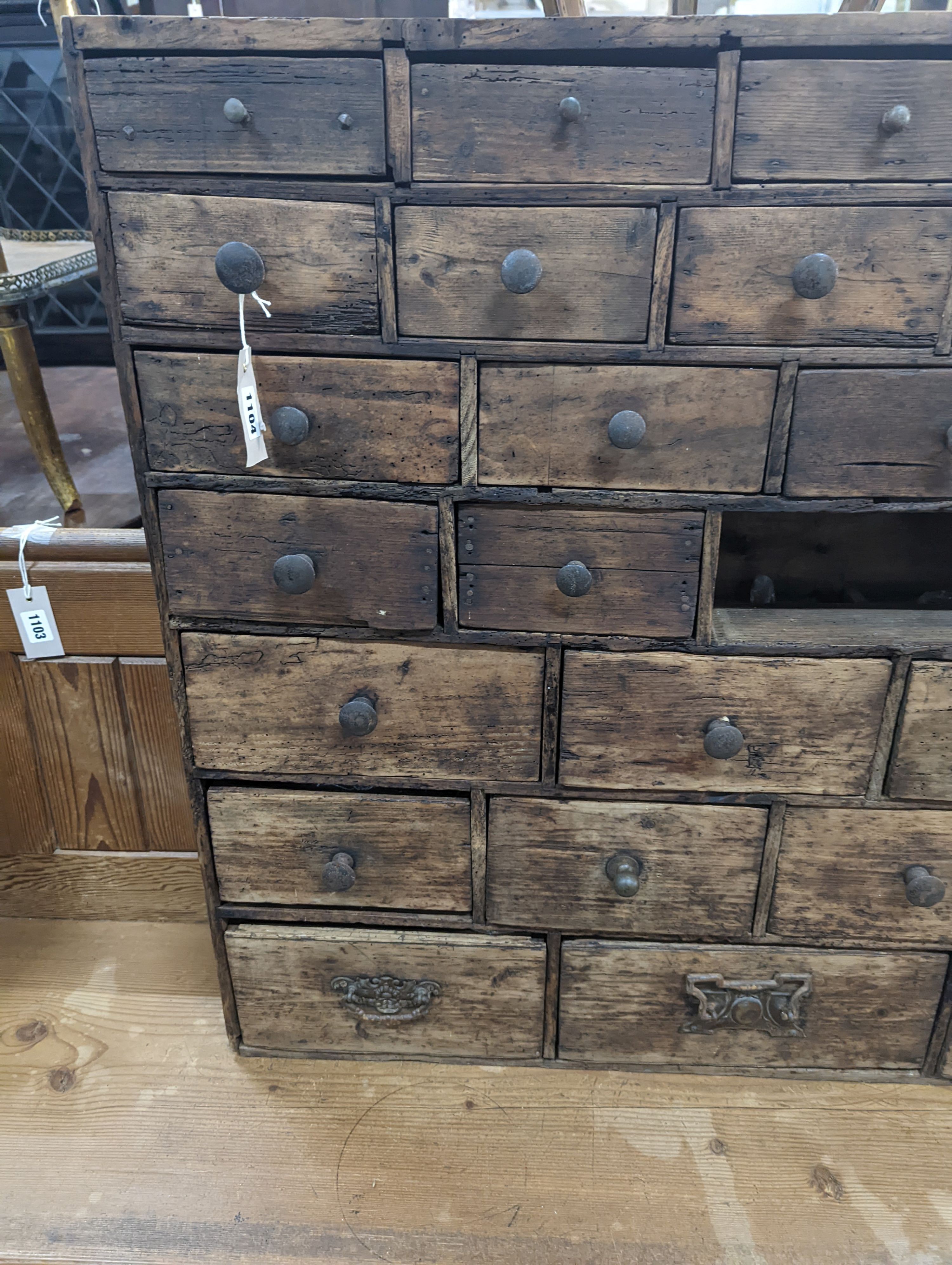 A 19th century fruitwood apothecary chest from the estate of Mary Wondrausch, containing rock samples and archaeological finds. width 91cm, depth 13cm, height 80cm (lacks three drawers)